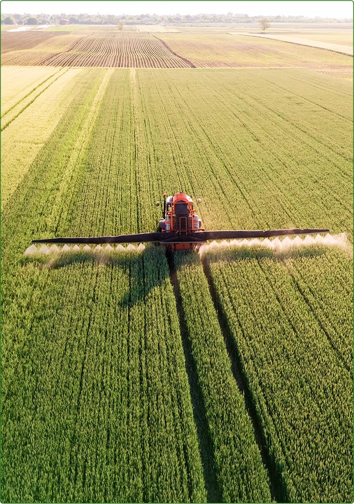 Agricultural equipment working on the field.